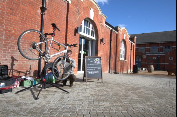 Dr Bike fixing bike outside the Student Hub